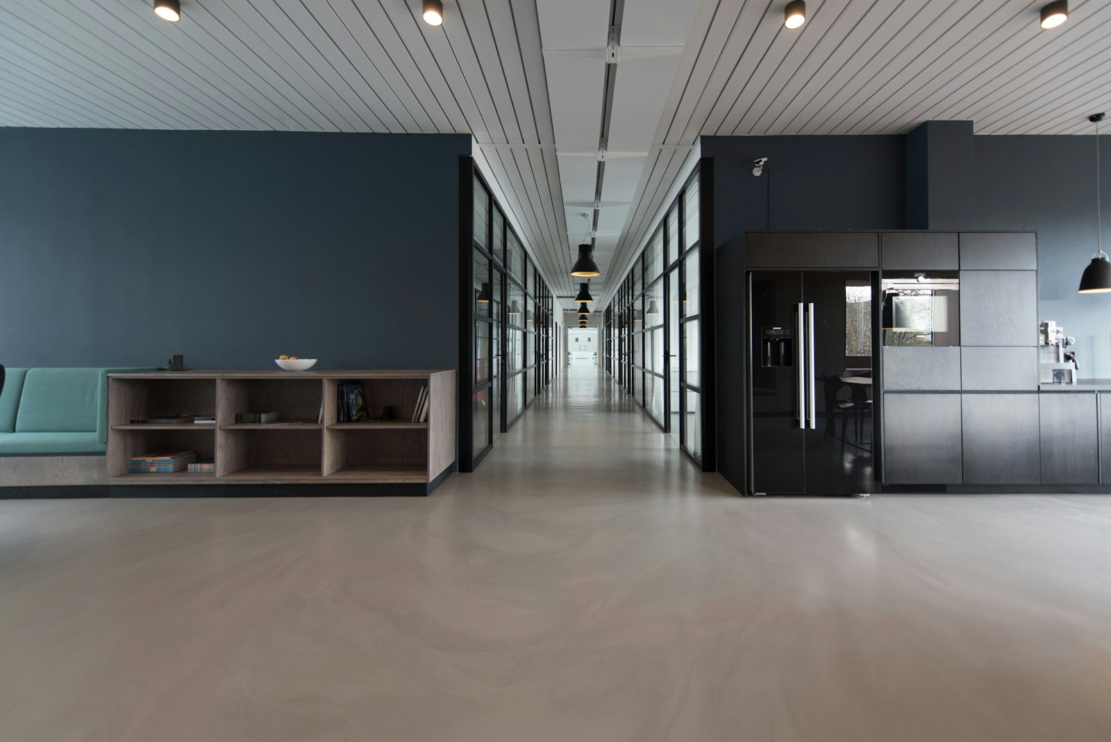 A pristine modern corporate office lobby with glass, clean surfaces and natural light
